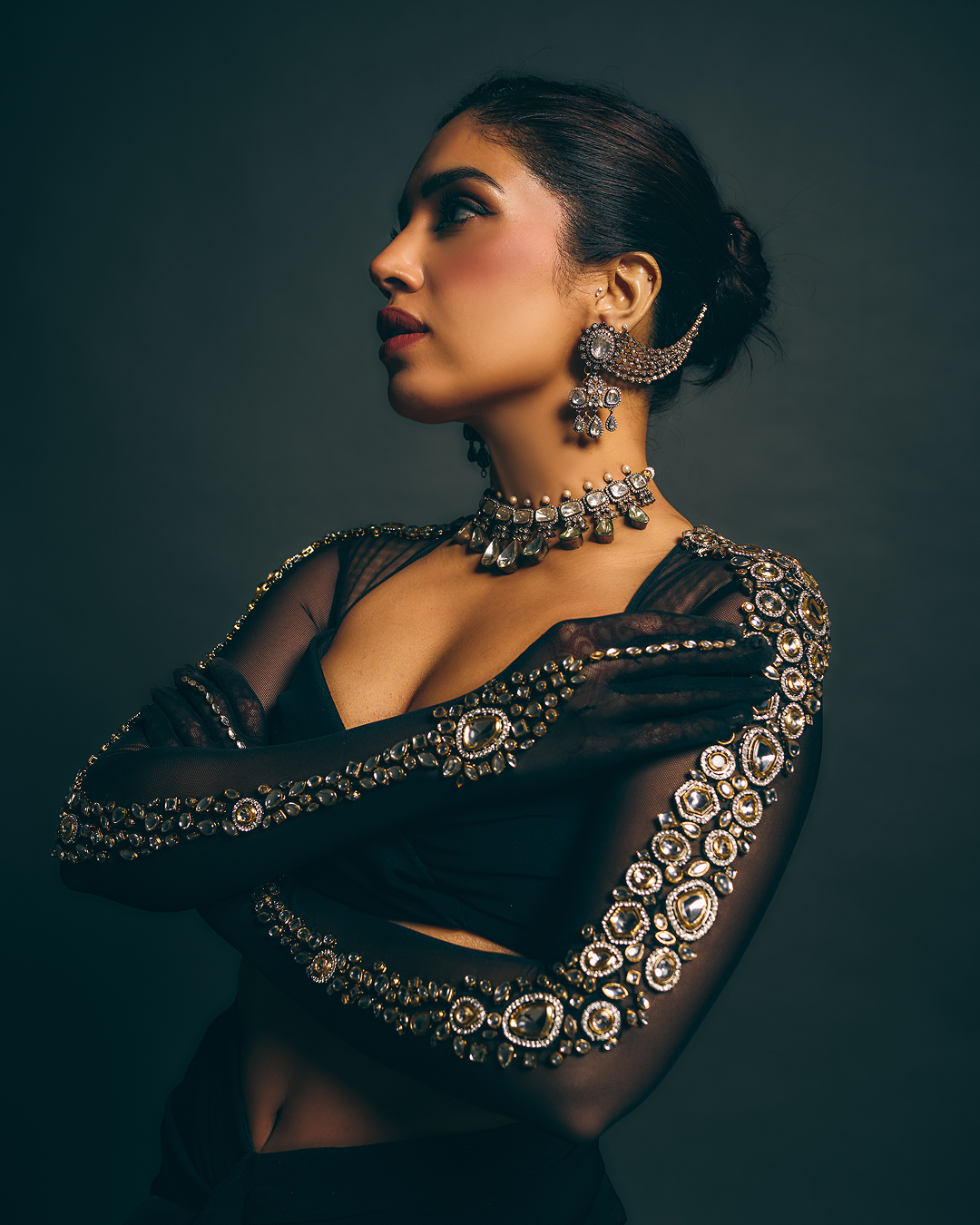 Black gloved sleeve blouse with Kundan stone embroidery with draped skirt